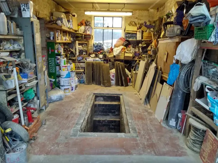 What we offer - workshop with vehicle inspection pit